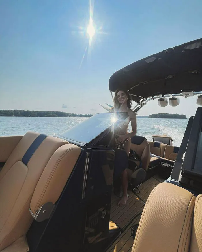 Olivia Culpo driving a boat Instagram