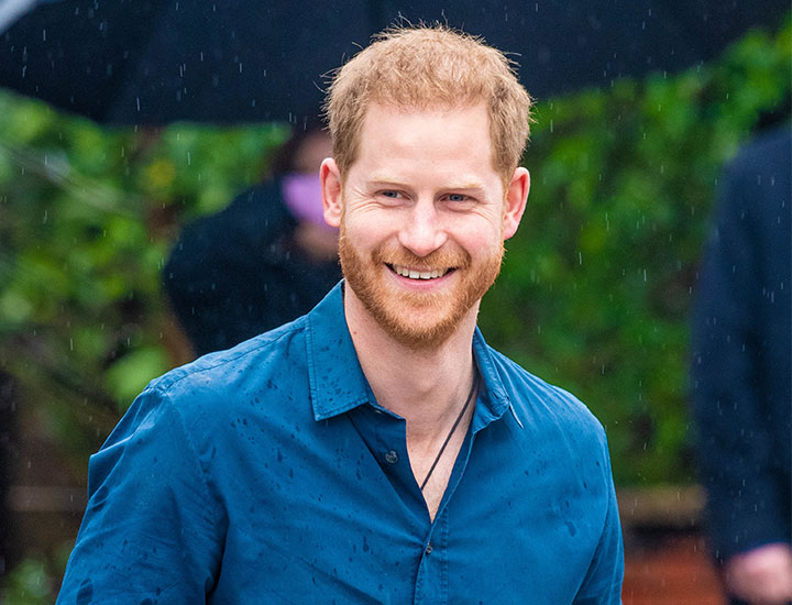 Prince Harry smiling in the rain