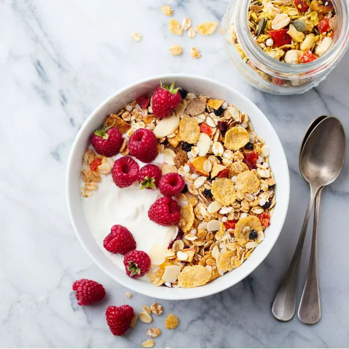 bowl of cereal with raspberries