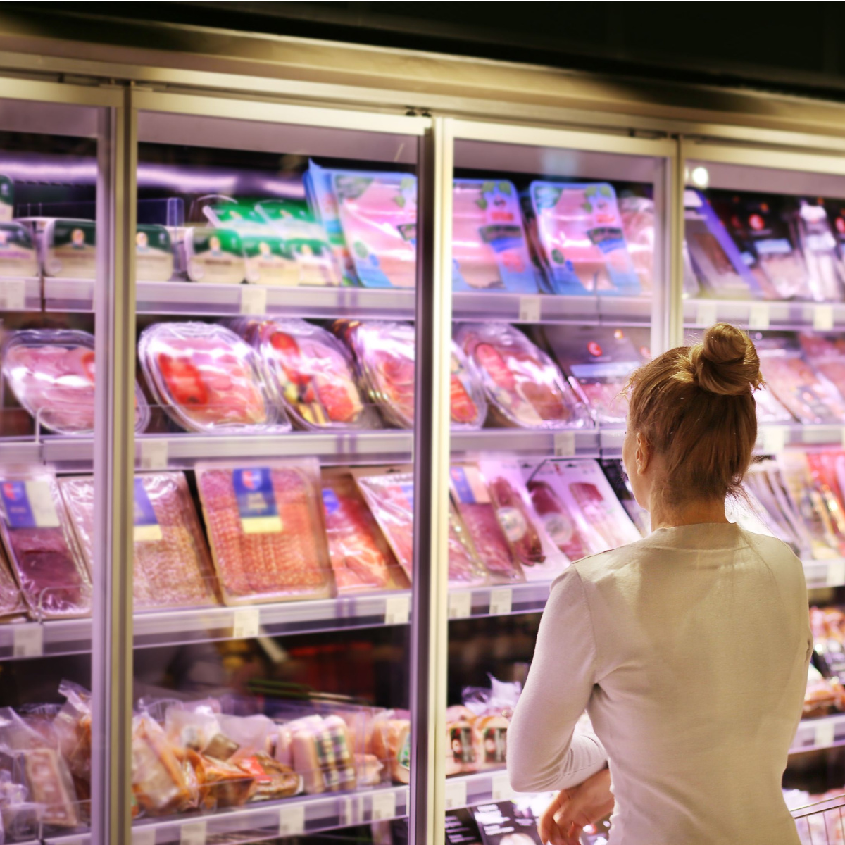 woman in frozen food aisle
