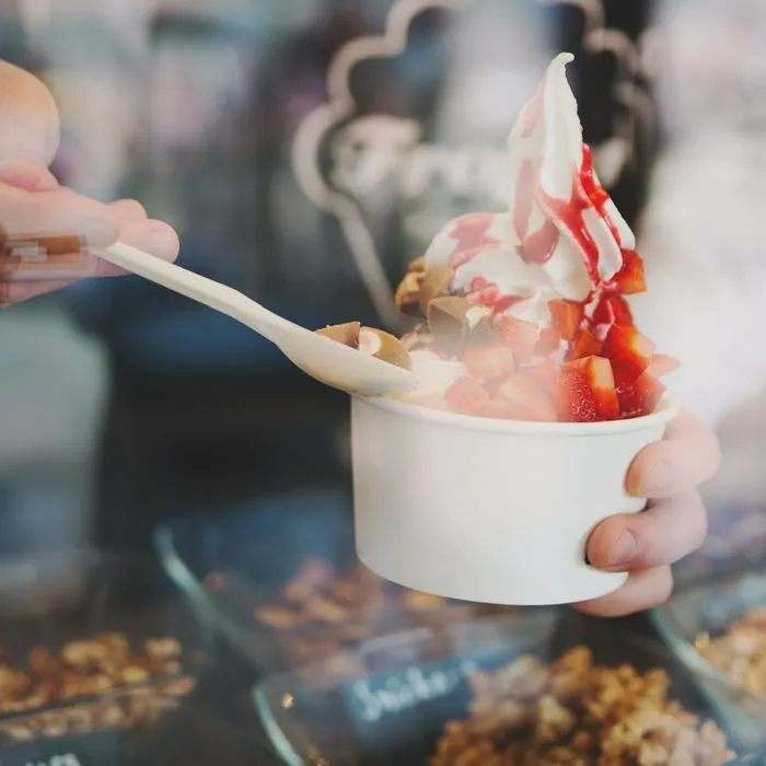 man holding frozen yogurt