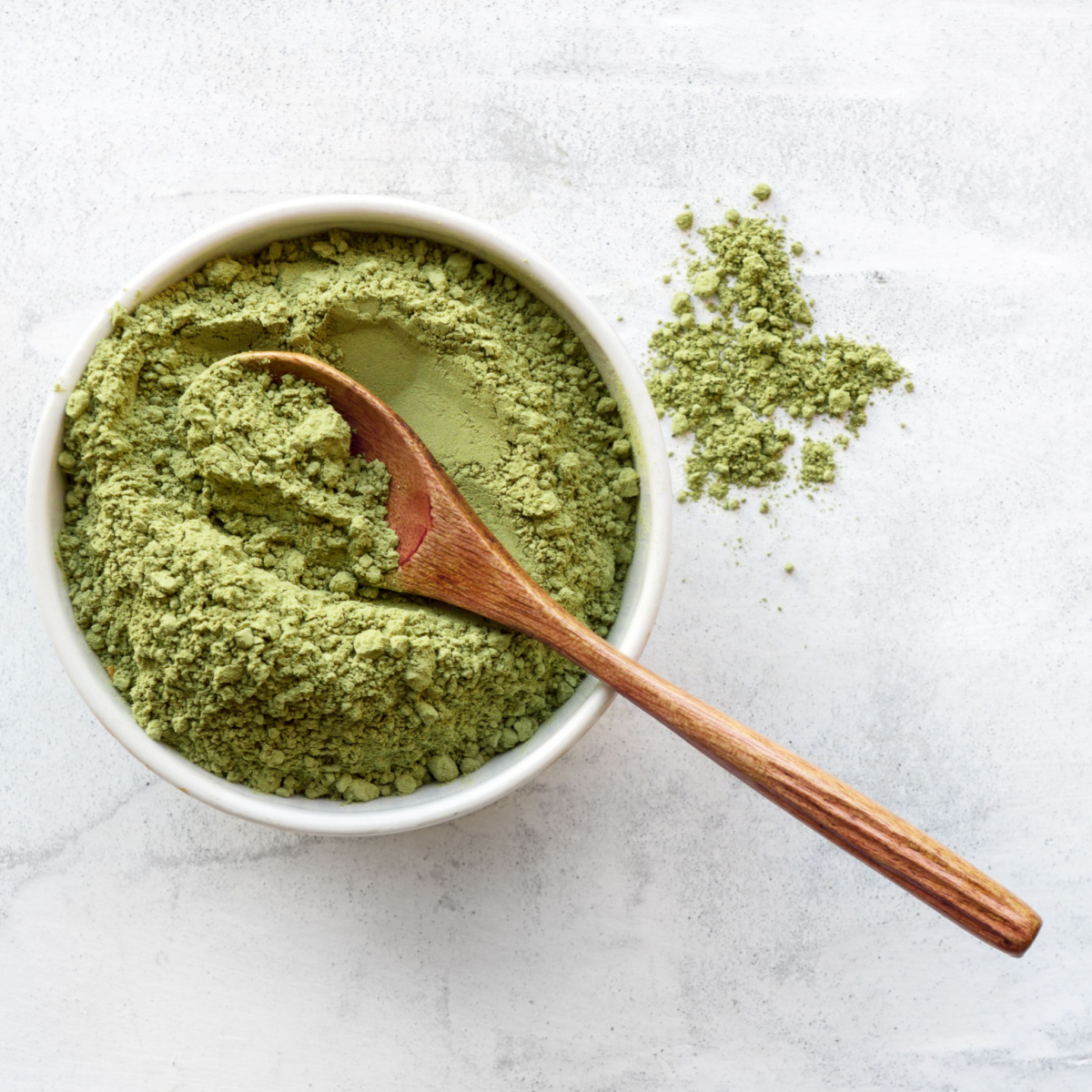 matcha powder with wooden spoon