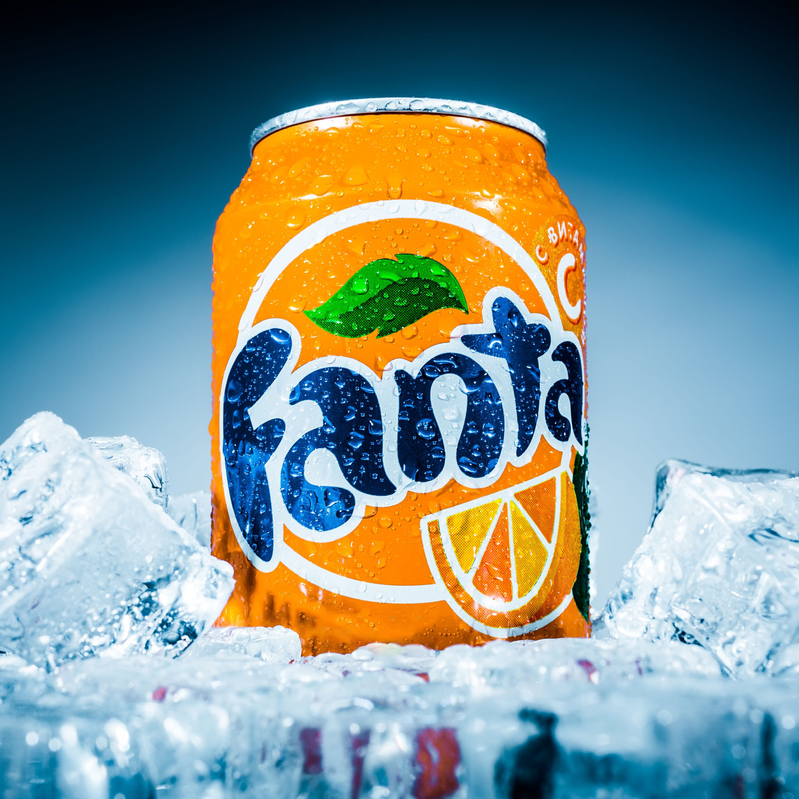 can of orange fanta in ice