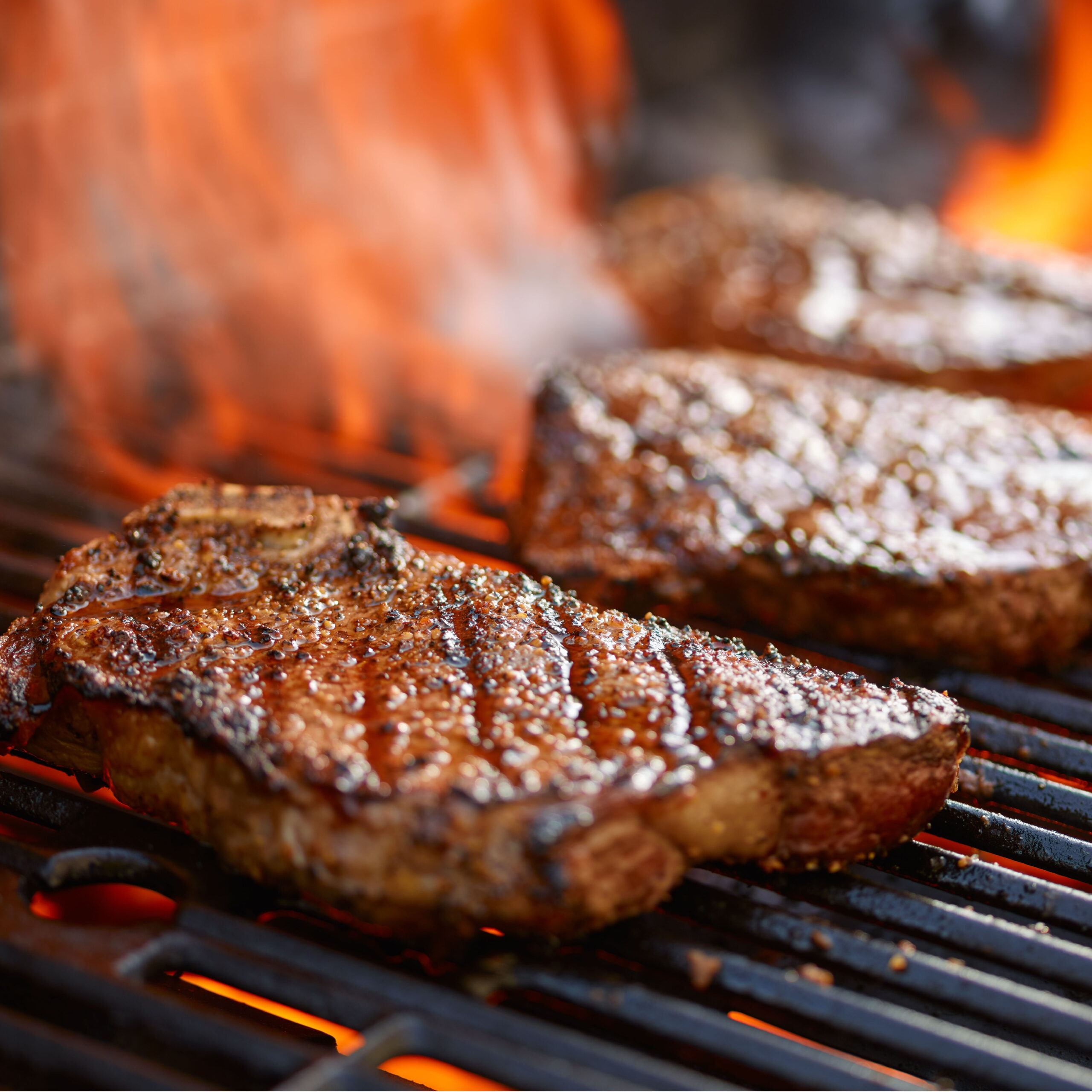 steaks on grill