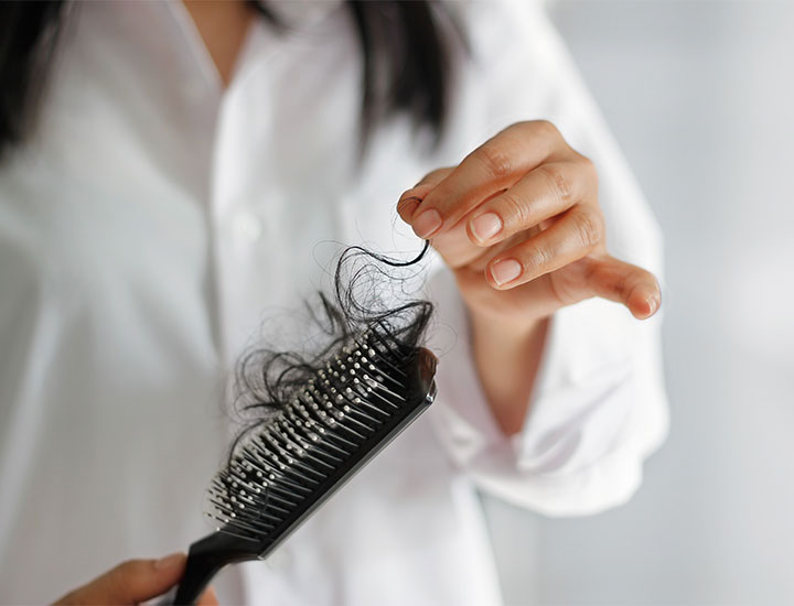 woman-hair-coming-out-brush