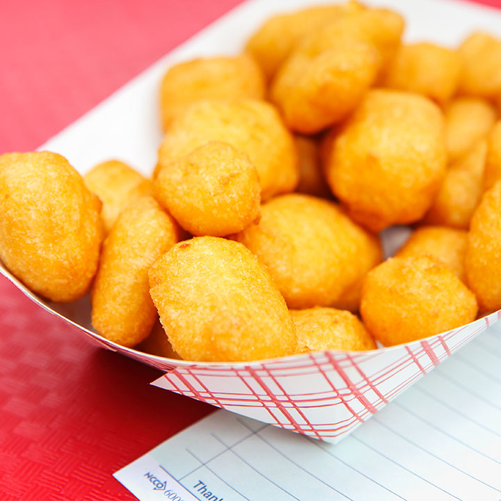 fried cheese curds in paper basket