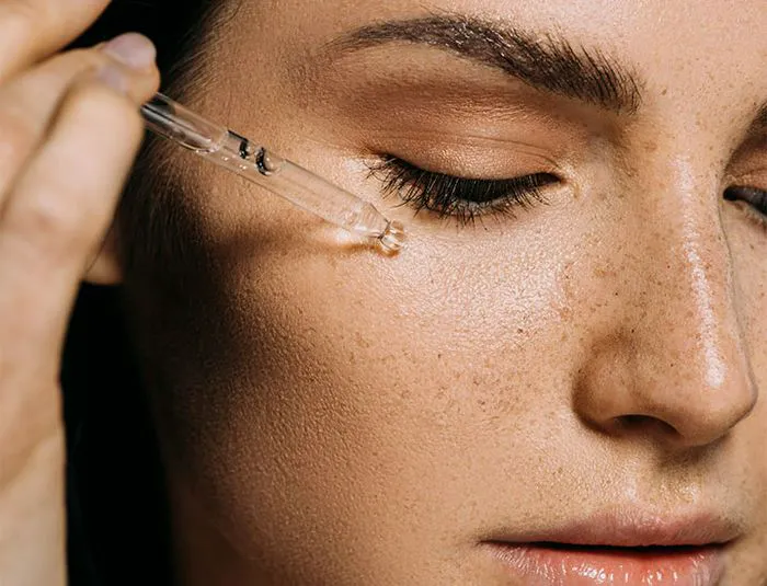 woman-applying-skincare