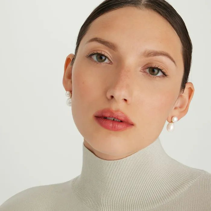 Bold pearl drop earrings showcasing elegance