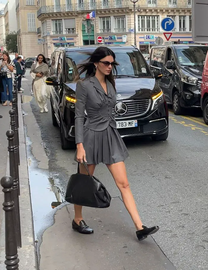 Kendall Jenner Paris Fashion Week vintage Galliano gray pleated dress