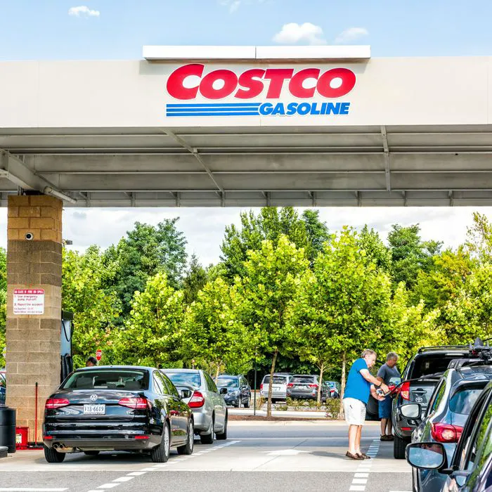 Costco gas station with long lines of cars waiting.