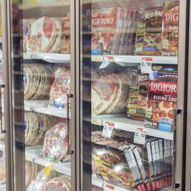 frozen pizza aisle at grocery store