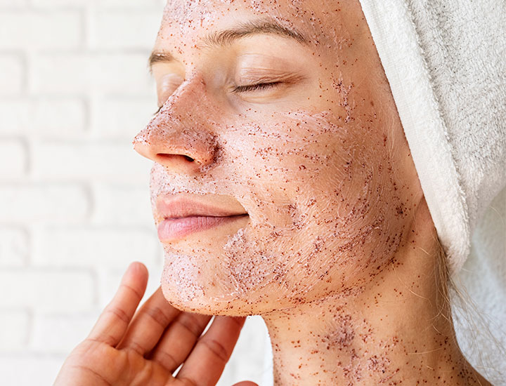 woman-using-face-scrub