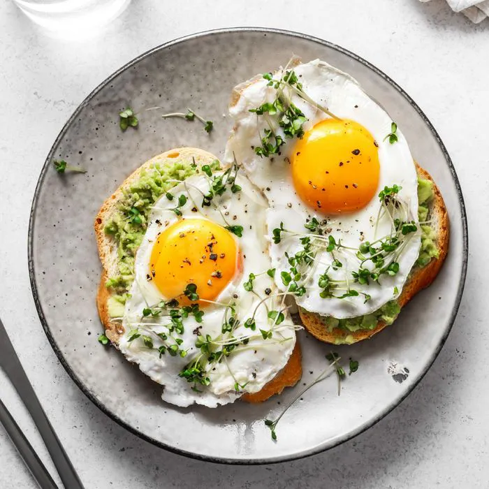 fried eggs on avocado toast
