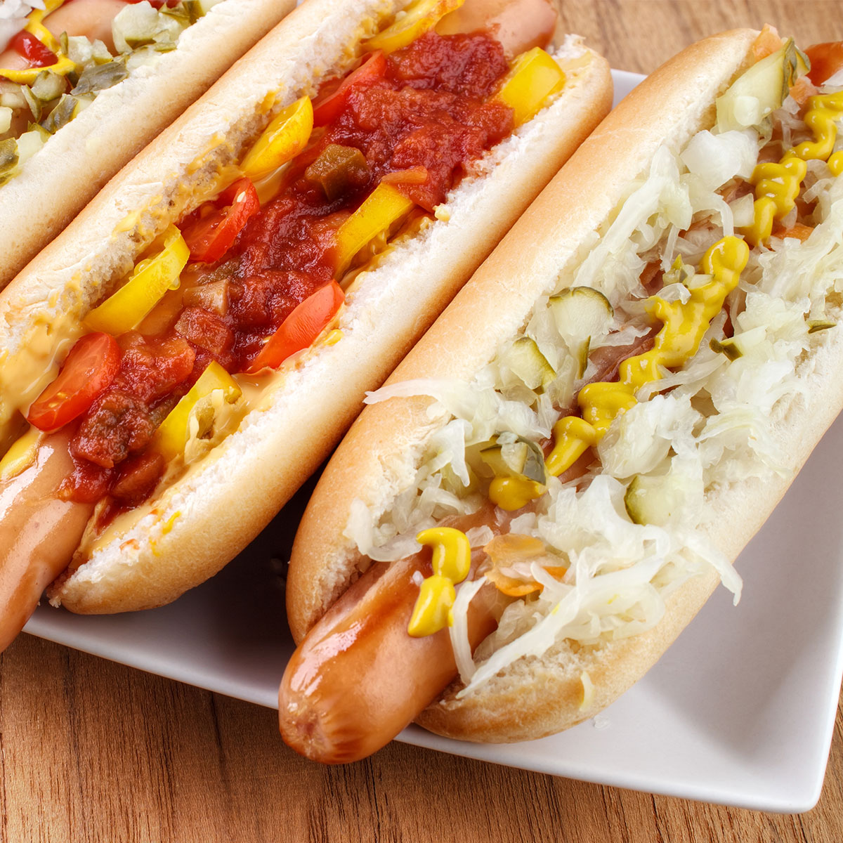 hot dogs with toppings like sauerkraut