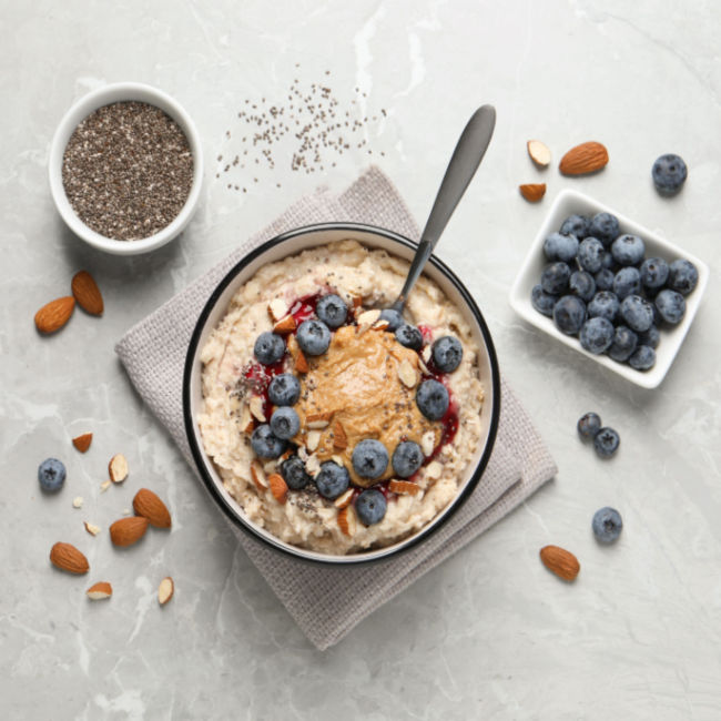 oatmeal topped with peanut butter and blueberries