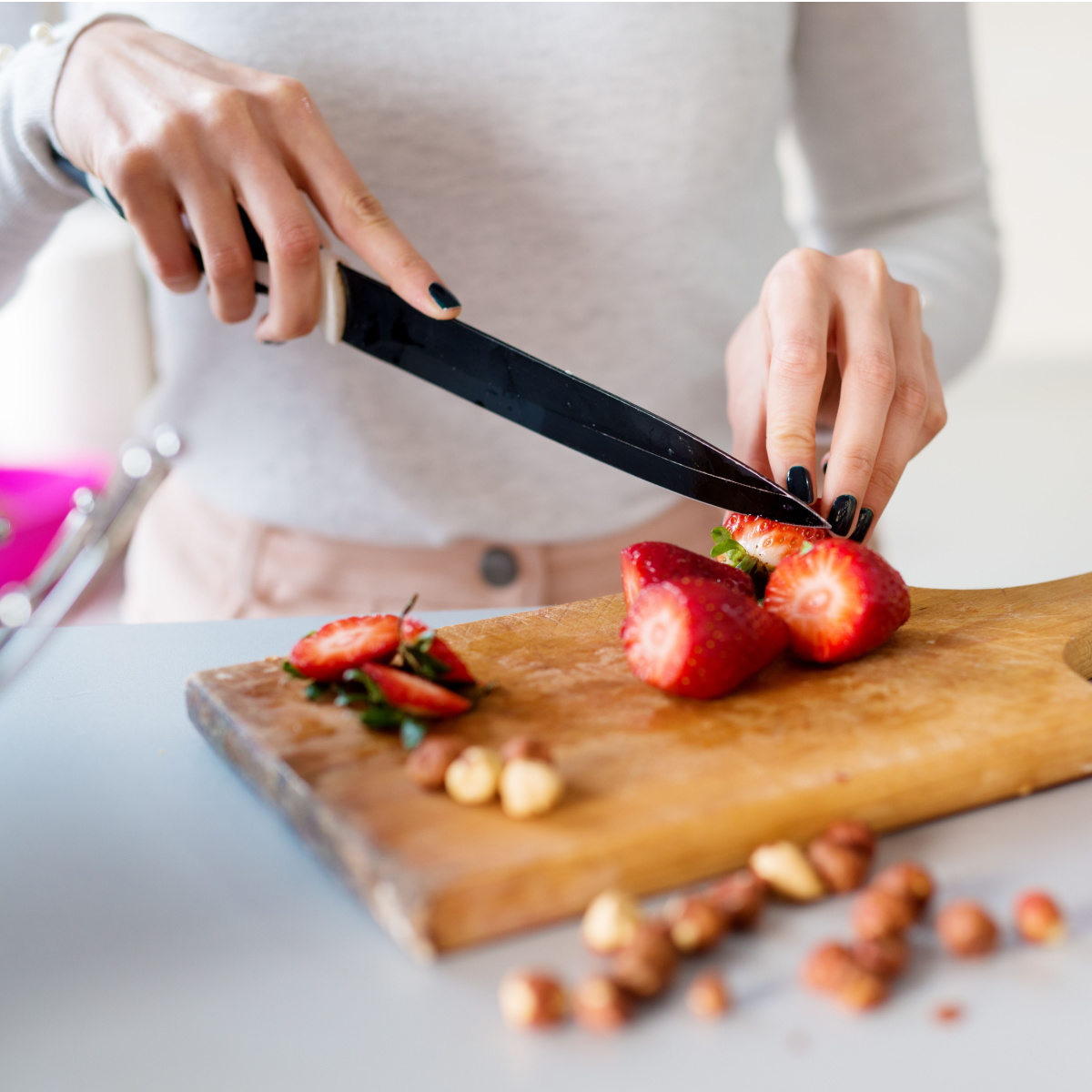 woman slicing strawberries