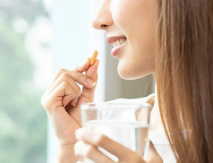 woman-taking-vitamin