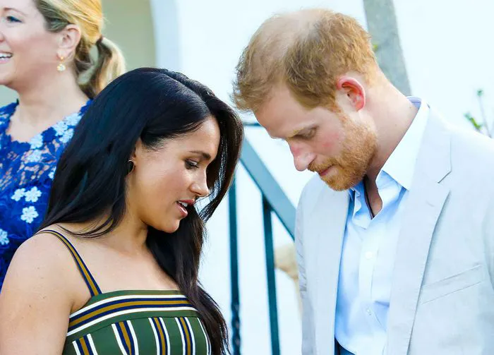 Meghan Markle Prince Harry looking down