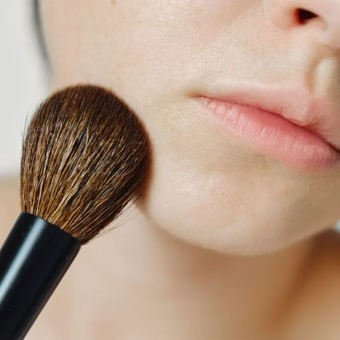 makeup-brush-touching-chin
