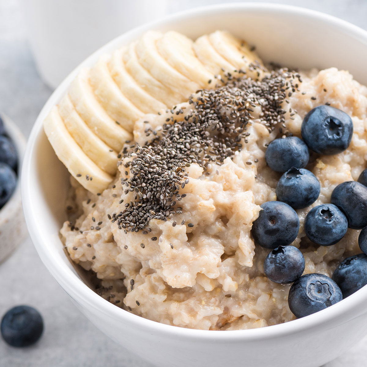 oatmeal topped with banana chia seeds and blueberries
