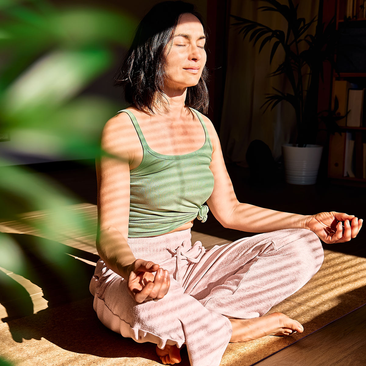 woman meditating at home