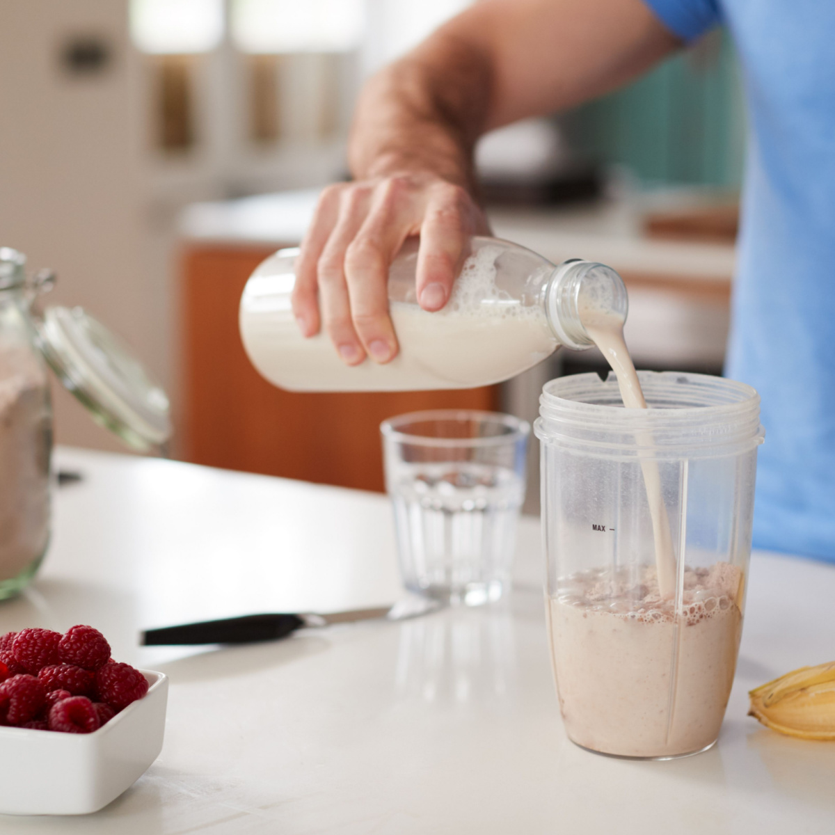 man making protein drink