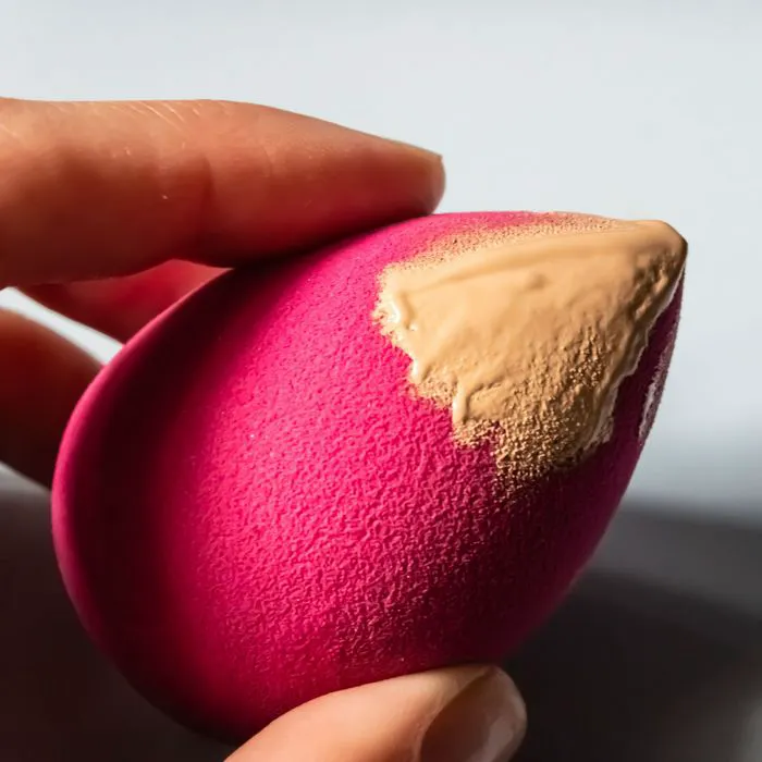 Beauty blender with concealer for seamless makeup application.