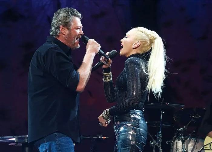 Gwen Stefani and Blake Shelton performing at Super Bowl Music Festival.