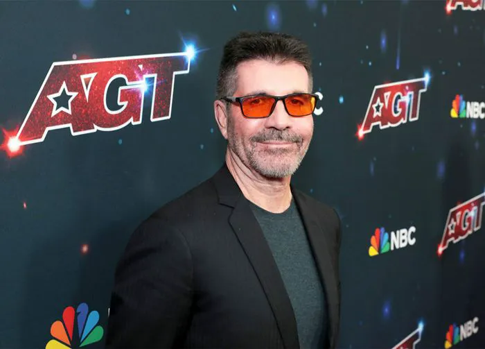 Simon Cowell orange glasses