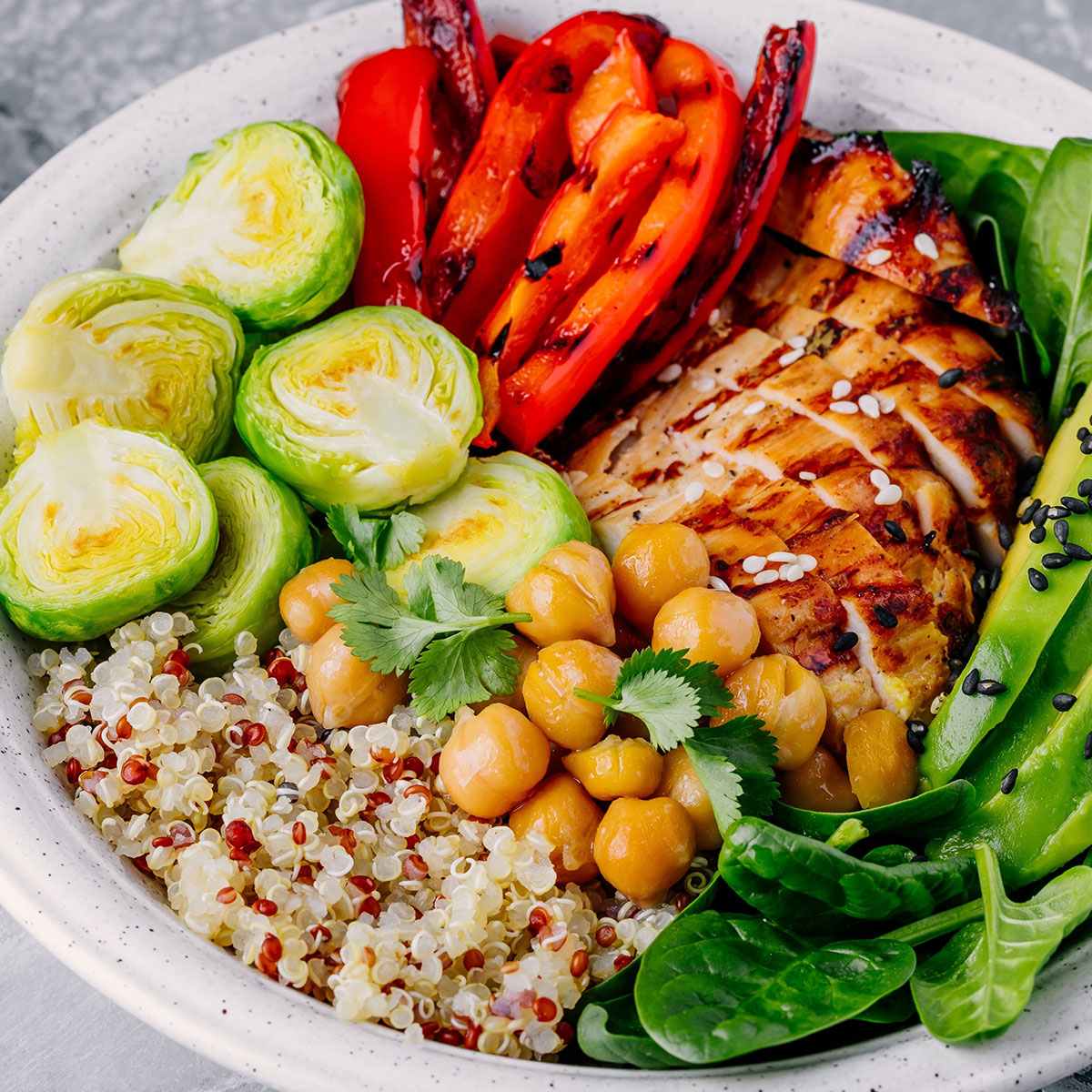 bowl with quinoa, chicken, chickpeas, veggies