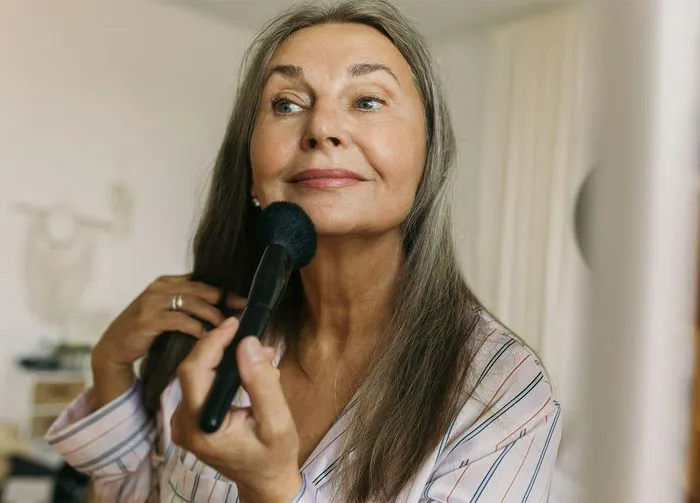 mature-woman-doing-makeup