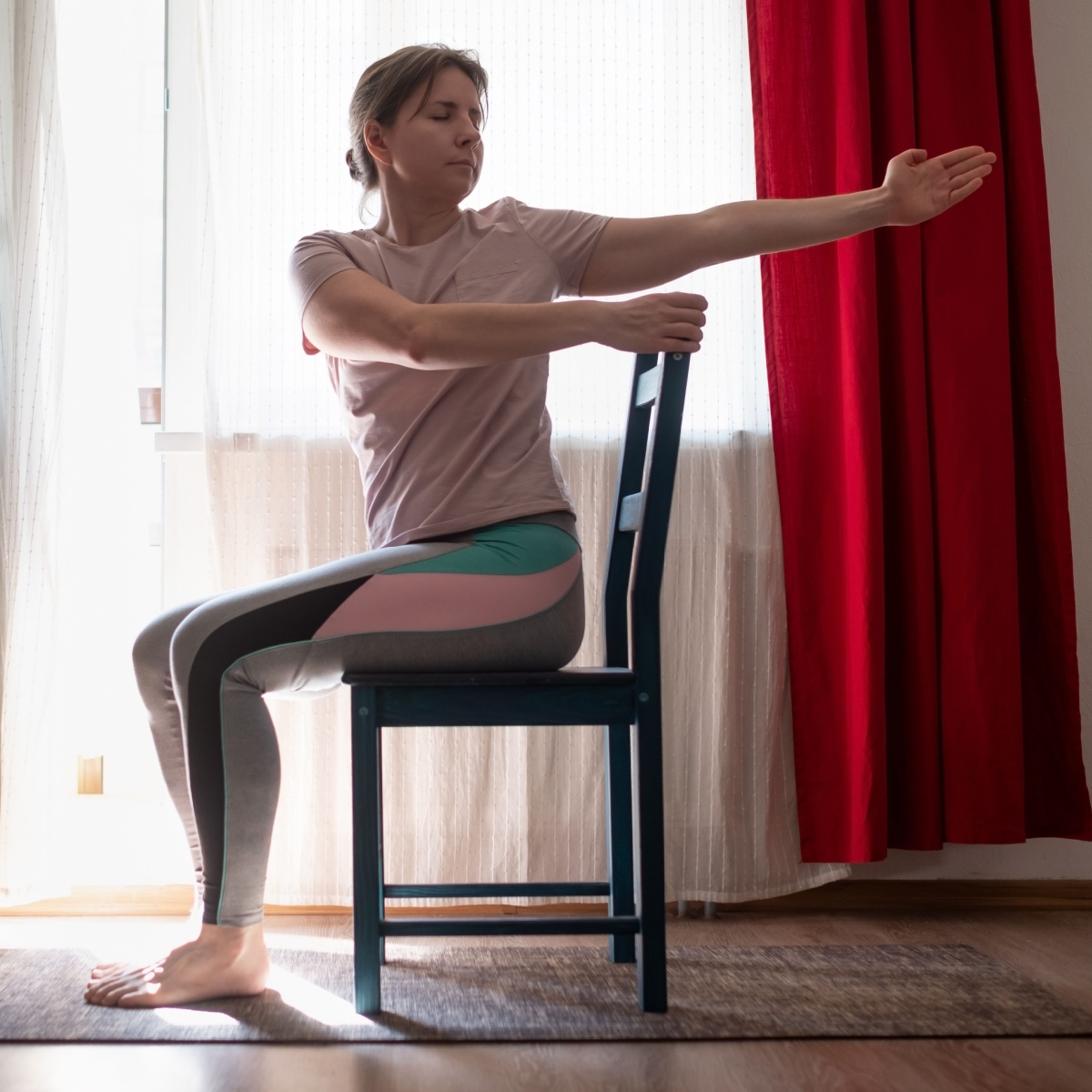 older woman doing seated twists