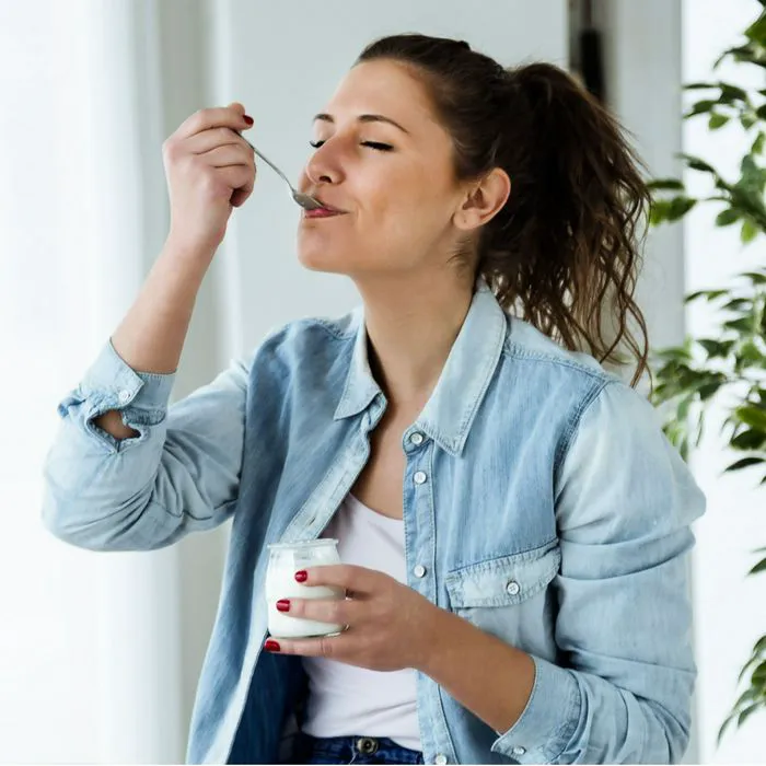 woman eating yogurt