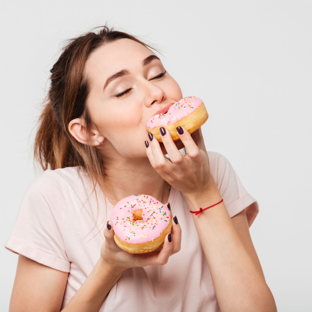 woman eating donuts