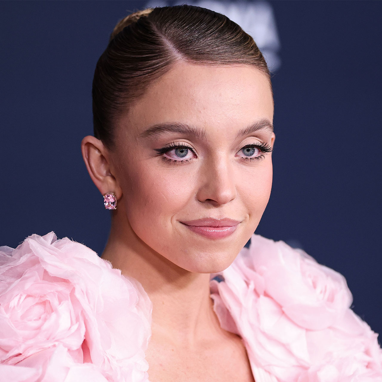 Sydney Sweeney Graces The Cover Of ‘Harper’s Bazaar’ In A Sports Bra & Leather Jacket As Fans React: ‘Absolutely Stunning’