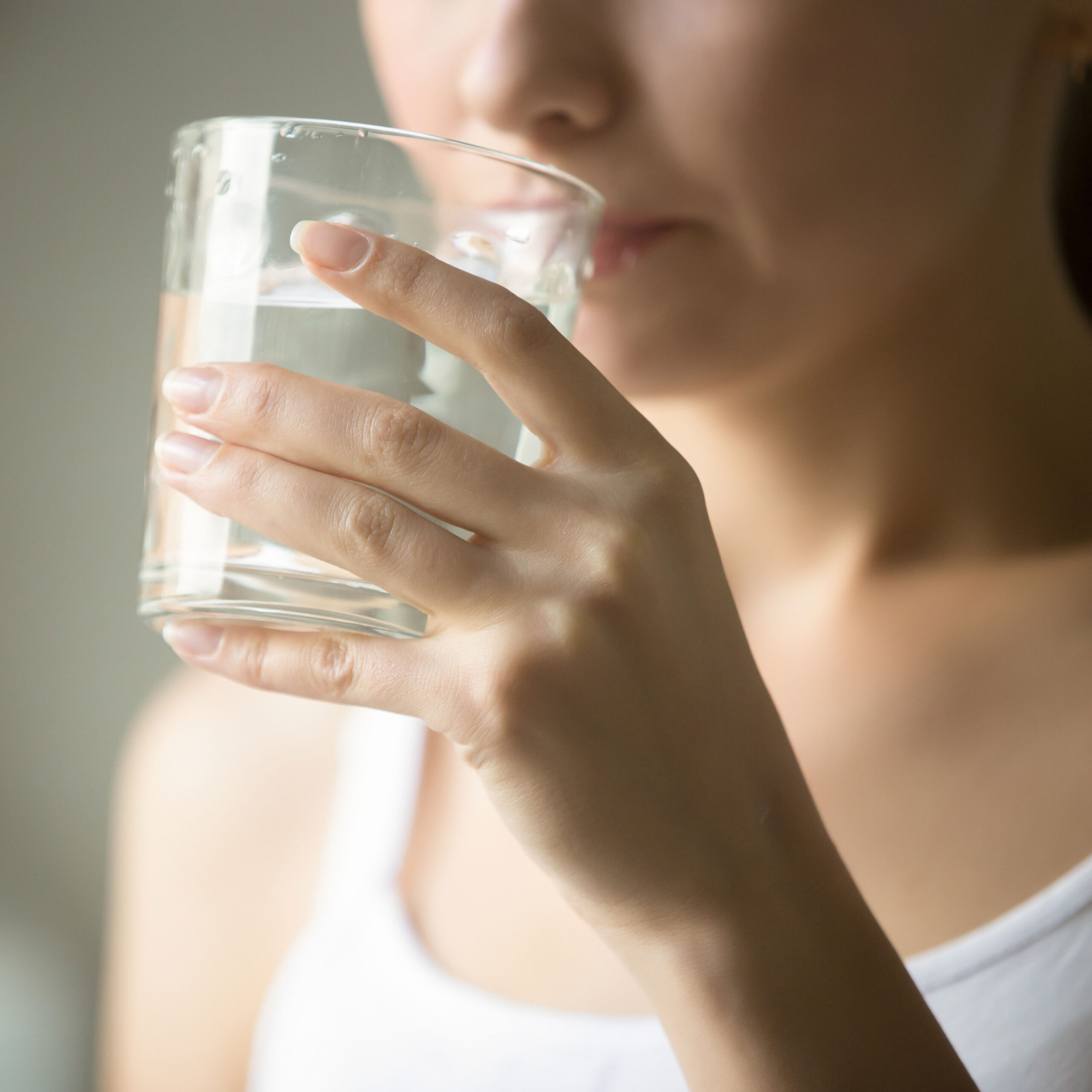 woman sipping on water