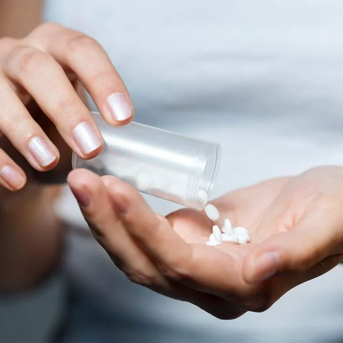 woman-taking-supplements