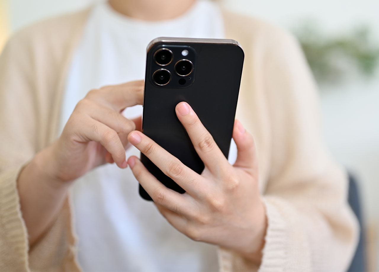 woman-using-black-iphone