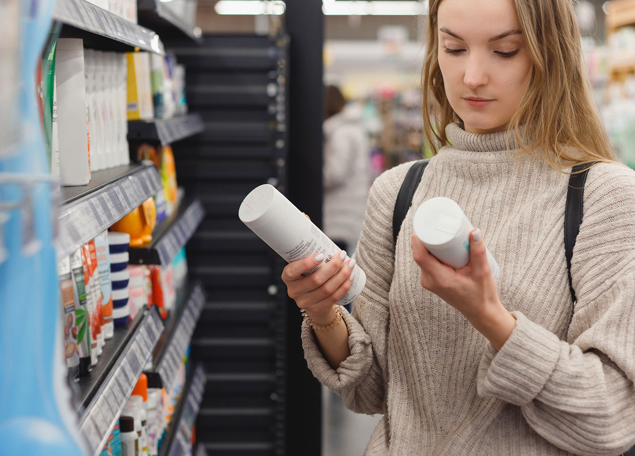 woman-checking-shampoo-ingredients