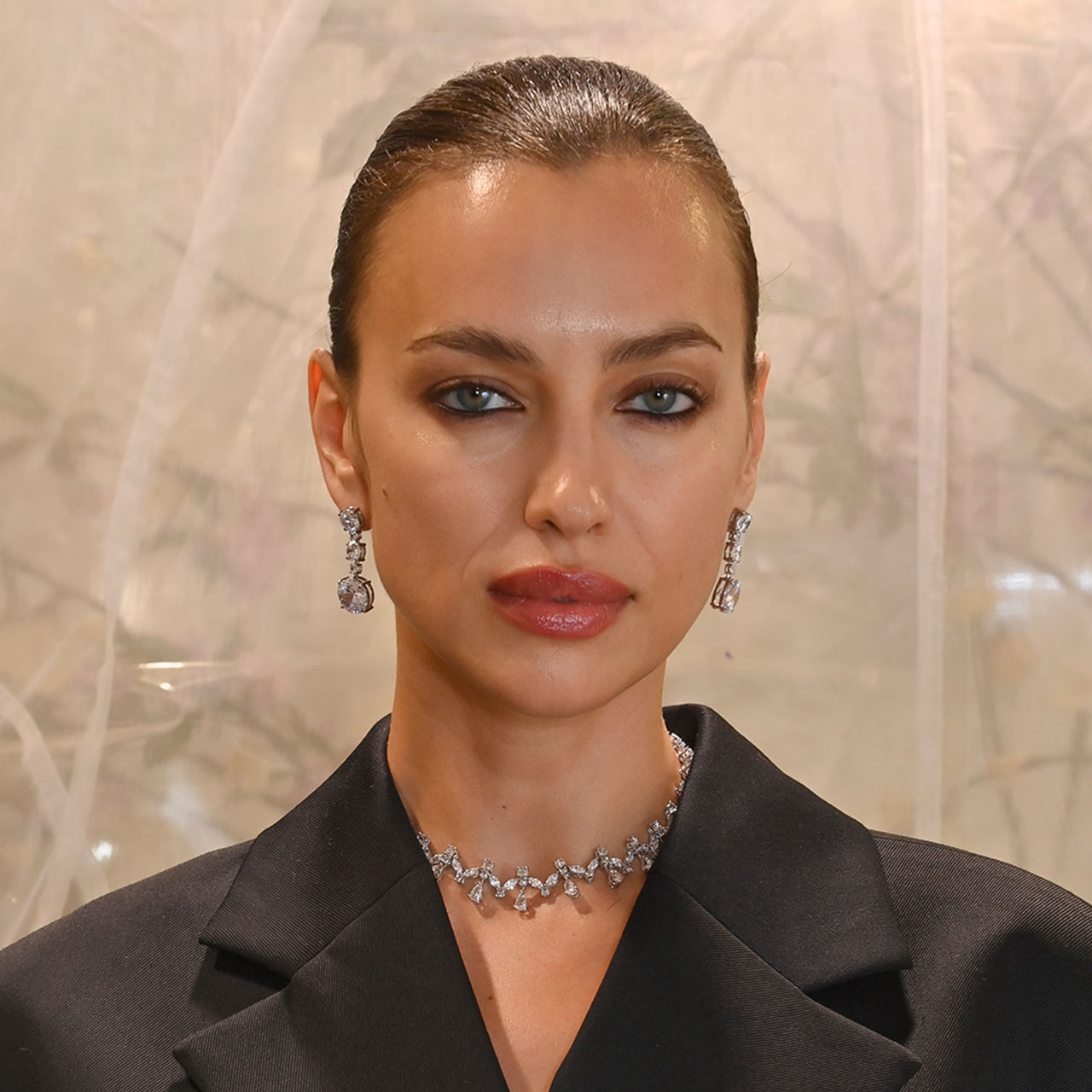 Irina Shayk embraces the no-pants trend in a belted blazer for the H&M & Rokh launch in London