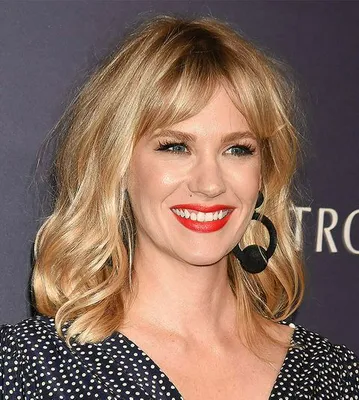 January Jones showcasing stylish curtain bangs and shag haircut.