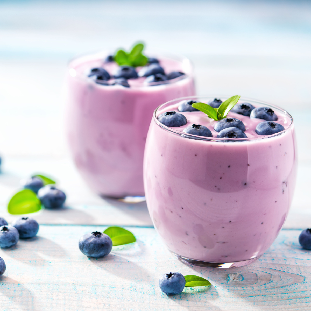 cups of blueberries and blueberry smoothie