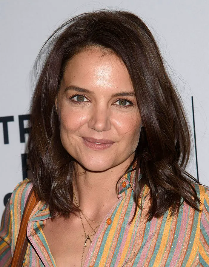 Katie Holmes flaunting brownie batter brunette hair.