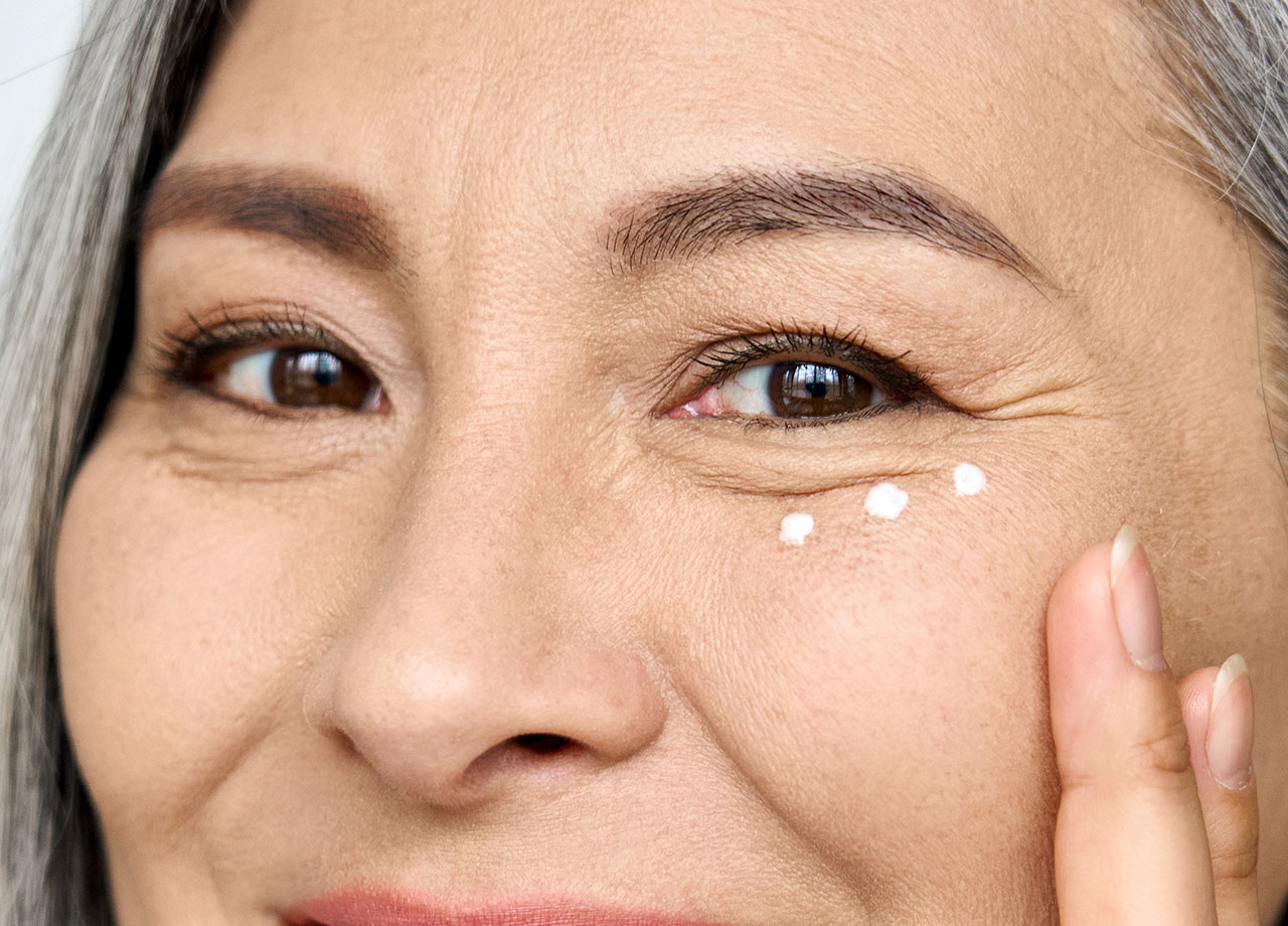 woman-applying-eye-cream