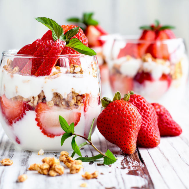glass of yogurt with berries