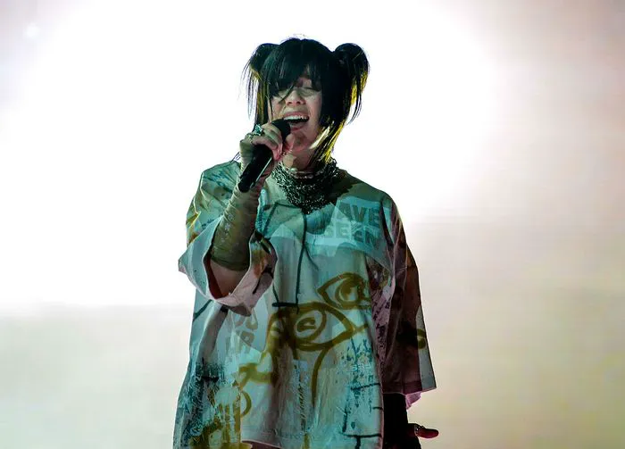 Billie Eilish performing dark hair