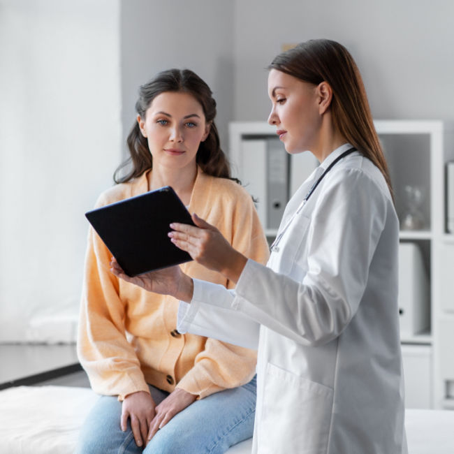 woman talking to doctor