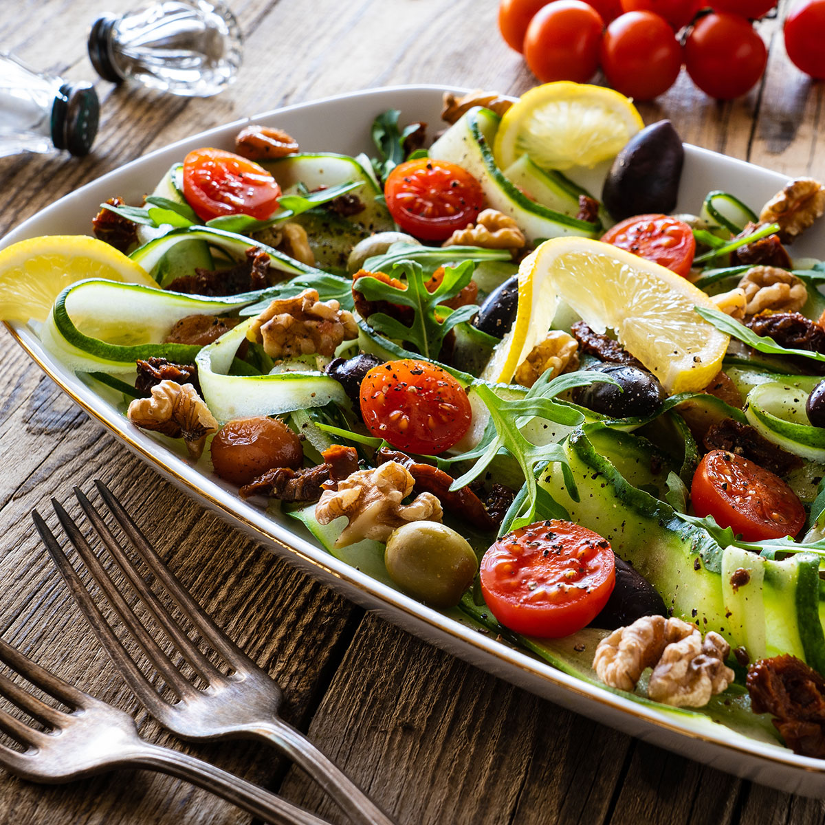 salad platter with cucumber, wallnuts, tomatoes