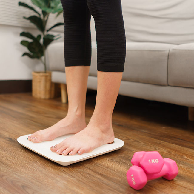 woman standing on scale