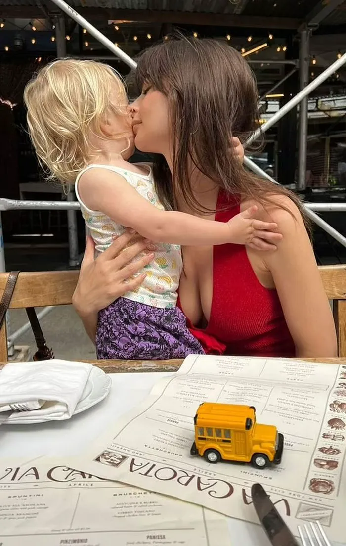 Emily Ratajkowski at lunch with son in red halter top